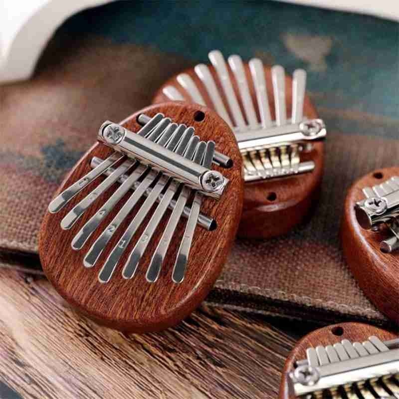 8 teclas Mini lindo Kalimba madera cristal dedo pulgar Piano regalo para niños